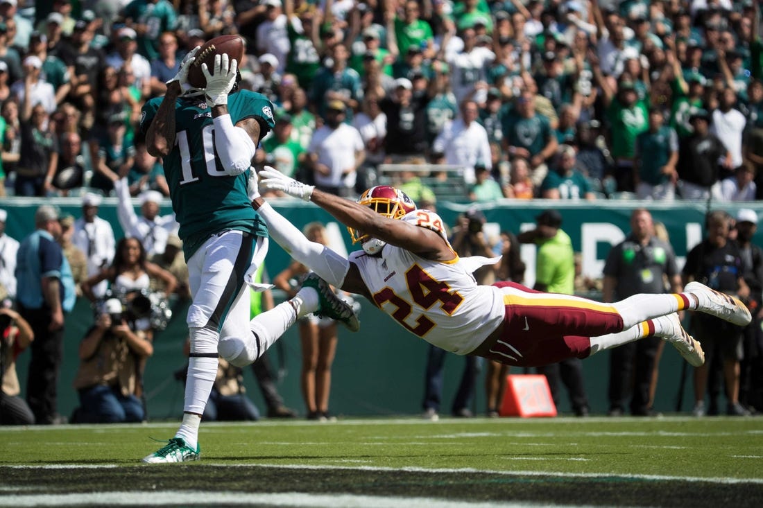Eagles' DeSean Jackson (10) brings in a deep pass in front of a diving Josh Norman (24) to score Sept. 8 at Lincoln Financial Field.

Sports Eagles Redskins