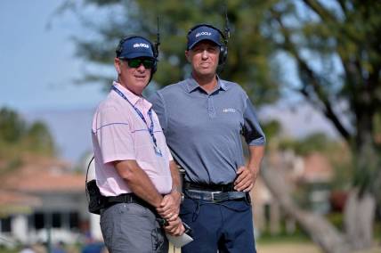 Jan 19, 2020; La Quinta, California, USA; Golf Channel on-course reporters Curt Byrum (L) and Jim MacKay look on during the final round of The American Express golf tournament at Stadium course at PGA West. Mandatory Credit: Orlando Ramirez-USA TODAY Sports