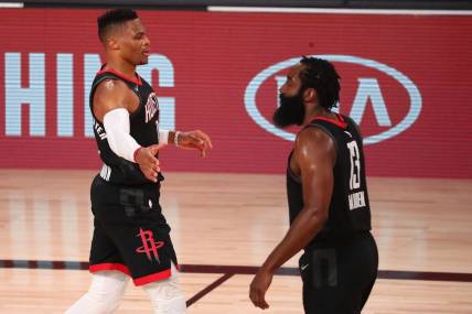 Sep 8, 2020; Lake Buena Vista, Florida, USA; Houston Rockets guard Russell Westbrook (left) celebrates with guard James Harden (13) after dunking against the Los Angeles Lakers during the first half of game three in the second round of the 2020 NBA Playoffs at AdventHealth Arena. Mandatory Credit: Kim Klement-USA TODAY Sports