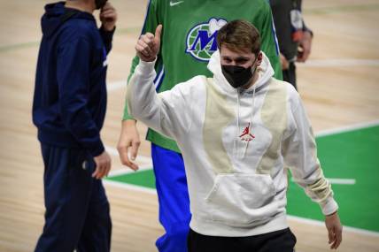 Dallas Mavericks guard Luka Doncic (77) gives a thumbs up to the crowd as he walks off the court after the game between the Dallas Mavericks and the Oklahoma City Thunder at the American Airlines Center. Mandatory Credit: Jerome Miron-USA TODAY Sports