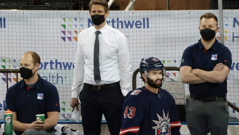 Mar 17, 2021; New York, New York, USA; Handling coaching duties for the New York Rangers against the Philadelphia Flyers are Hartford Wolf Pack head coach Kris Knoblauch (seen here watching warm-ups) and Wolf Pack associate head coach Gord Murphy and Rangers associate general manager Chris Drury at Madison Square Garden. Due to the NHL COVID-10 protocol, the Rangers coaching staff were not available for tonights game. Mandatory Credit:  Bruce Bennett/POOL PHOTOS-USA TODAY Sports