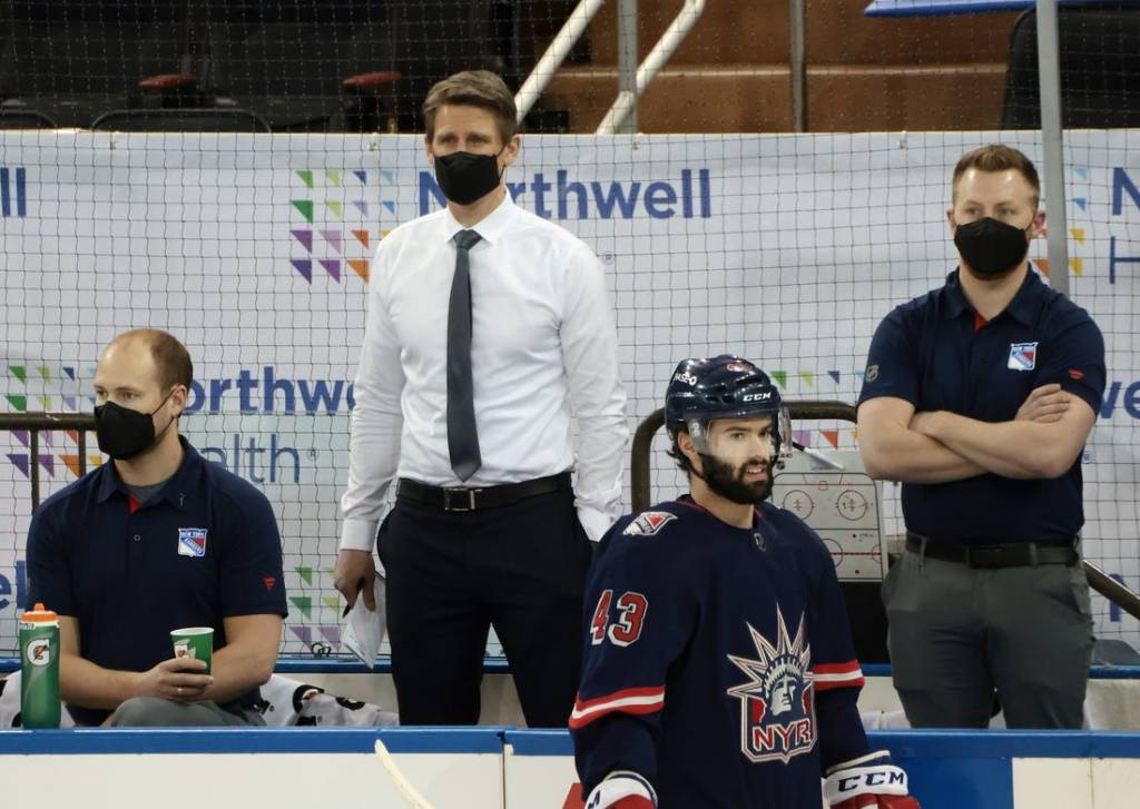 Mar 17, 2021; New York, New York, USA; Handling coaching duties for the New York Rangers against the Philadelphia Flyers are Hartford Wolf Pack head coach Kris Knoblauch (seen here watching warm-ups) and Wolf Pack associate head coach Gord Murphy and Rangers associate general manager Chris Drury at Madison Square Garden. Due to the NHL COVID-10 protocol, the Rangers coaching staff were not available for tonights game. Mandatory Credit:  Bruce Bennett/POOL PHOTOS-USA TODAY Sports