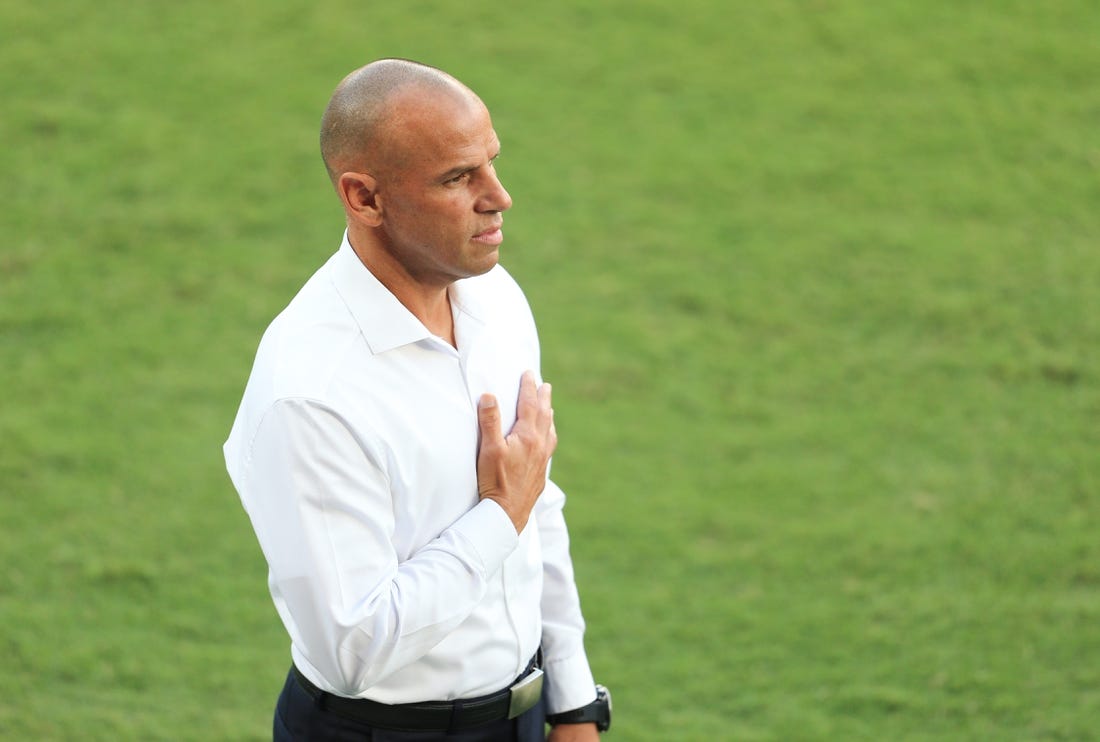 May 22, 2021; Orlando, Florida, USA; Toronto FC head coach Chris Armas stands for the National Anthem before the match against Orlando City at Orlando City Stadium. Mandatory Credit: Matt Stamey-USA TODAY Sports