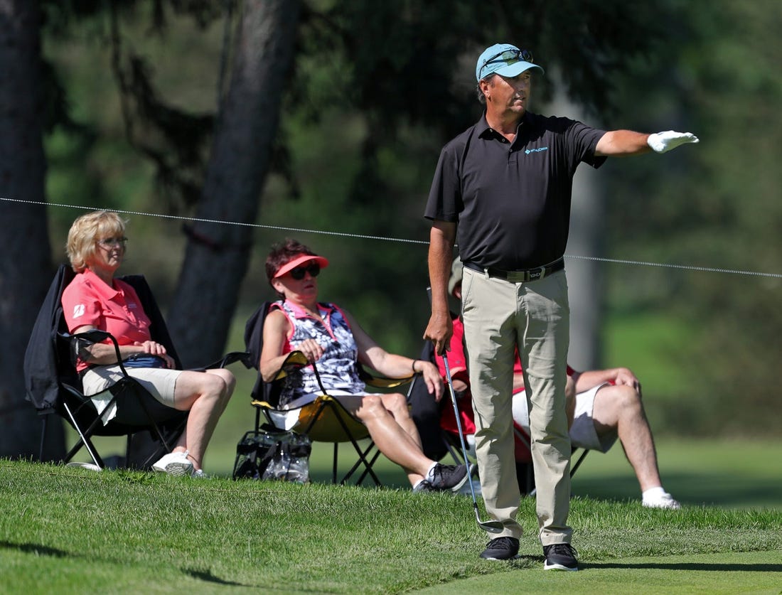 Shane Bertsch reacts as his ball stops short of the hole on No. 11 during the first round of the Bridgestone Senior Players Championship at Firestone Country Club on Thursday, June 24, 2021, in Akron, Ohio.

Bridgestone24 14