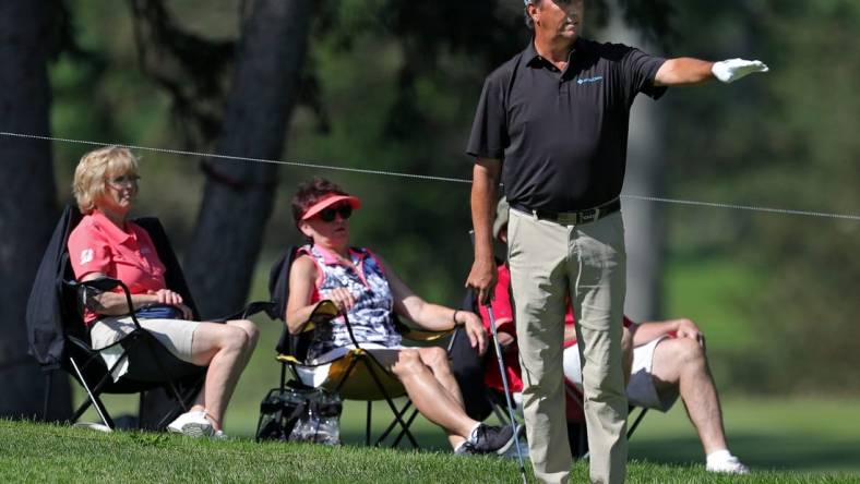 Shane Bertsch reacts as his ball stops short of the hole on No. 11 during the first round of the Bridgestone Senior Players Championship at Firestone Country Club on Thursday, June 24, 2021, in Akron, Ohio.

Bridgestone24 14