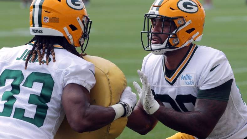 July 29, 2021; Green Bay, WI, USA; Green Bay Packers running back Aaron Jones (33) and running back A.J. Dillon (28) take part in a drill during the second day of training camp Thursday, July 29, 2021 in Green Bay, Wis.Mandatory Credit: Mark Hoffman-USA TODAY NETWORK