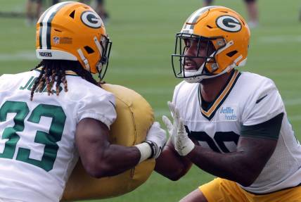 July 29, 2021; Green Bay, WI, USA; Green Bay Packers running back Aaron Jones (33) and running back A.J. Dillon (28) take part in a drill during the second day of training camp Thursday, July 29, 2021 in Green Bay, Wis.Mandatory Credit: Mark Hoffman-USA TODAY NETWORK