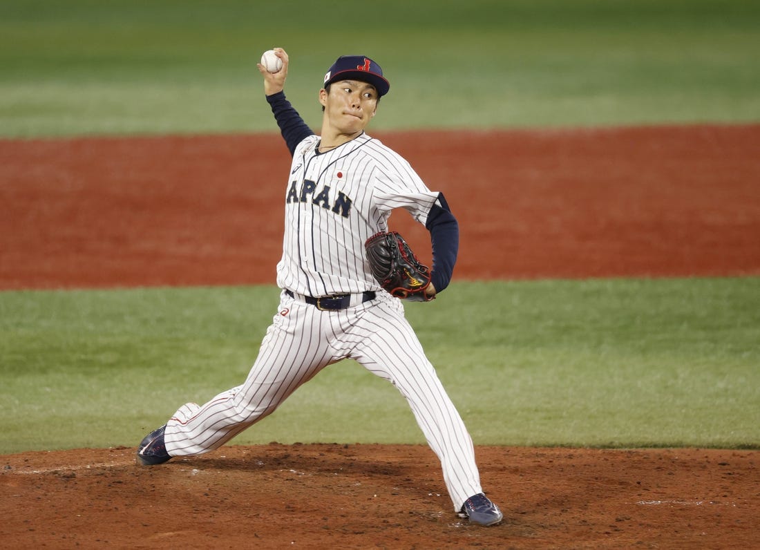 Aug 4, 2021; Yokohama, Japan; Team Japan pitcher Yoshinobu Yamamoto (17) throws a pitch against Korea in a baseball semifinal match during the Tokyo 2020 Olympic Summer Games at Yokohama Baseball Stadium. Mandatory Credit: Yukihito Taguchi-USA TODAY Sports