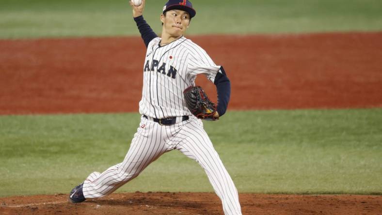 Aug 4, 2021; Yokohama, Japan; Team Japan pitcher Yoshinobu Yamamoto (17) throws a pitch against Korea in a baseball semifinal match during the Tokyo 2020 Olympic Summer Games at Yokohama Baseball Stadium. Mandatory Credit: Yukihito Taguchi-USA TODAY Sports