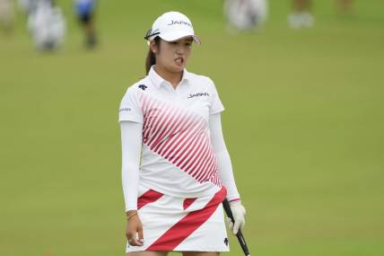 Aug 7, 2021; Tokyo, Japan; Mone Inami (JPN) reacts after her putt on the 18th hole during the final round of the women's individual stroke play of the Tokyo 2020 Olympic Summer Games at Kasumigaseki Country Club. Mandatory Credit: Michael Madrid-USA TODAY Sports