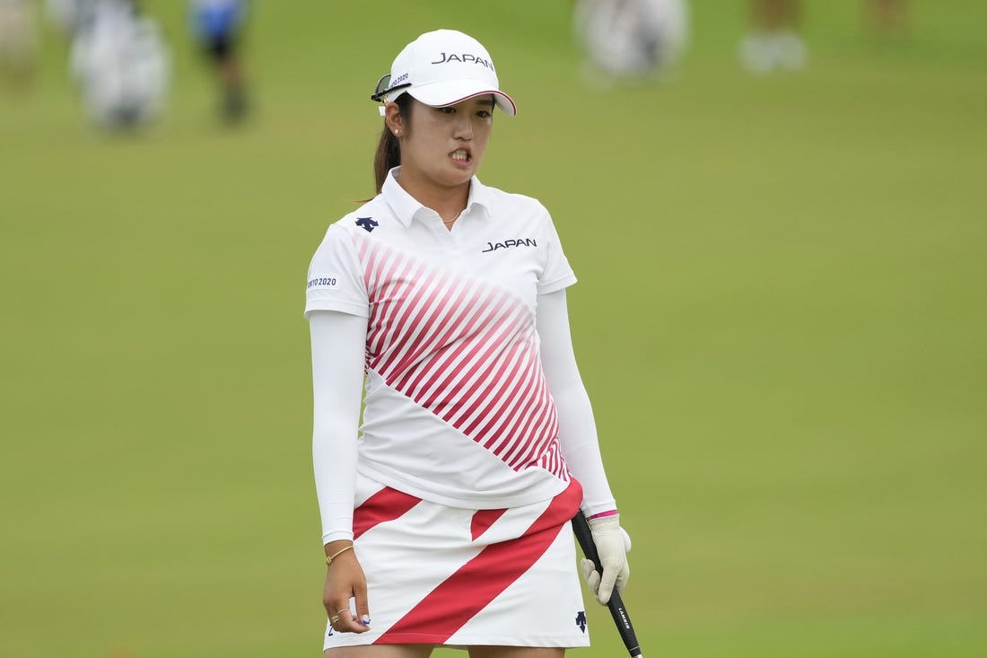Aug 7, 2021; Tokyo, Japan; Mone Inami (JPN) reacts after her putt on the 18th hole during the final round of the women's individual stroke play of the Tokyo 2020 Olympic Summer Games at Kasumigaseki Country Club. Mandatory Credit: Michael Madrid-USA TODAY Sports
