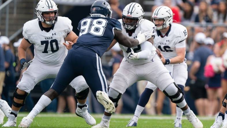 (File photo) Yale Bulldogs offensive lineman Kiran Amegadjie (72) blocks Connecticut Huskies defensive lineman Lwal Uguak (98) during the first half at Rentschler Field at Pratt & Whitney Stadium. Mandatory Credit: Gregory Fisher-USA TODAY Sports