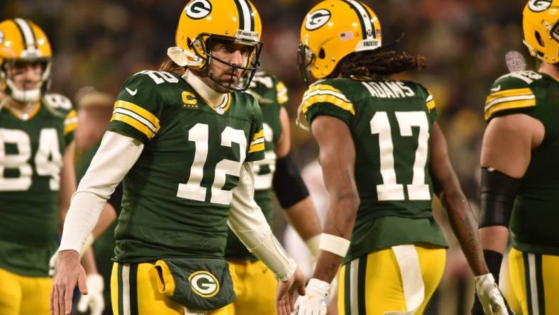 Jan 22, 2022; Green Bay, Wisconsin, USA; Green Bay Packers quarterback Aaron Rodgers (12) and wide receiver Davante Adams (17) in action against the San Francisco 49ers during a NFC Divisional playoff football game at Lambeau Field. Mandatory Credit: Jeffrey Becker-USA TODAY Sports