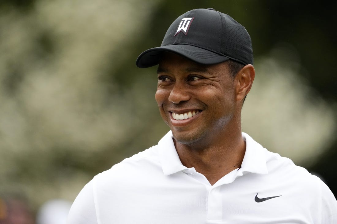 Apr 6, 2022; Augusta, Georgia, USA; Tiger Woods smiles at the practice facility during a practice round of The Masters golf tournament at Augusta National Golf Club. Mandatory Credit: Rob Schumacher-USA TODAY Sports