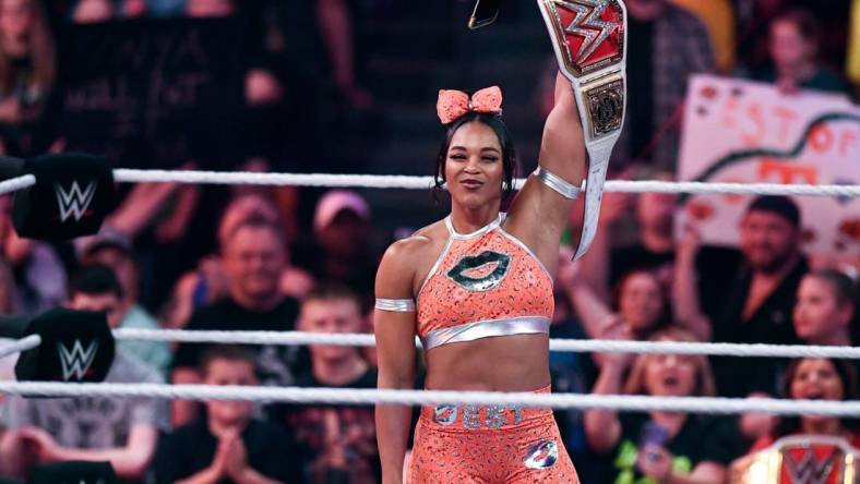 This year's Big 12 conference championship Most Outstanding Player receives a custom-made belt, such as the version WWE women's champion Bianca Belair raises in the file photo from an event in Knoxville, Tenn., in 2022. 

Kns Biancahomecoming 0427