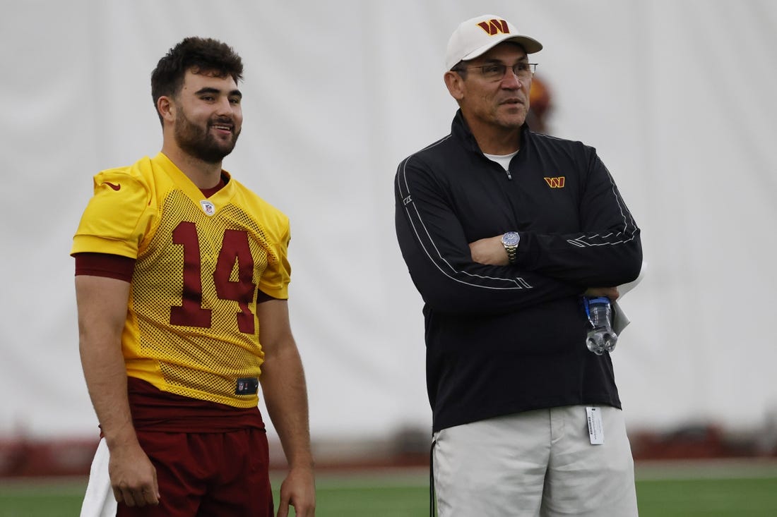 May 6, 2022; Ashburn, Virginia, USA; Washington Commanders head coach Ron Rivera (R) talks with Commanders quarterback Sam Howell (14) during Washington Commanders rookie minicamp at Inova Performance Center In Ashburn, VA. Mandatory Credit: Geoff Burke-USA TODAY Sports