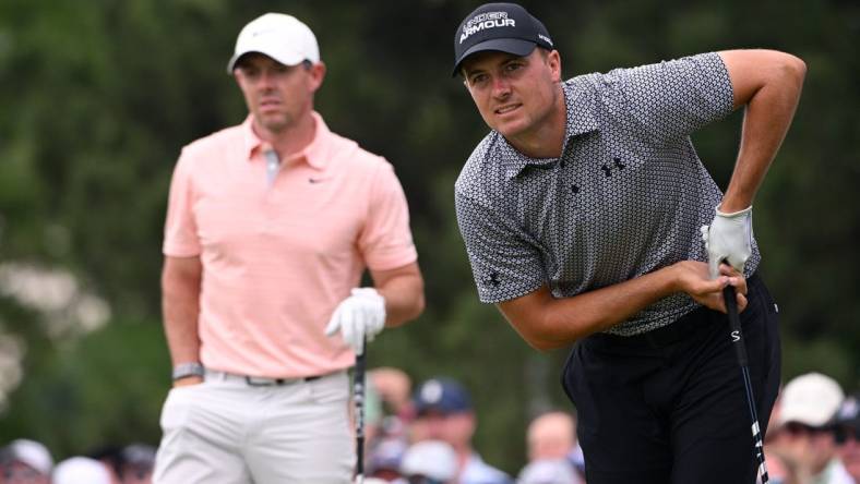 May 20, 2022; Tulsa, Oklahoma, USA; Jordan Spieth (right) watches his shot on the seventh tee alongside Rory McIlroy during the second round of the PGA Championship golf tournament at Southern Hills Country Club. Mandatory Credit: Orlando Ramirez-USA TODAY Sports