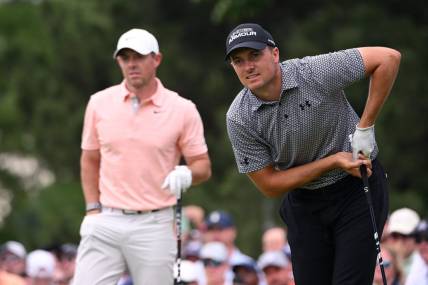 May 20, 2022; Tulsa, Oklahoma, USA; Jordan Spieth (right) watches his shot on the seventh tee alongside Rory McIlroy during the second round of the PGA Championship golf tournament at Southern Hills Country Club. Mandatory Credit: Orlando Ramirez-USA TODAY Sports