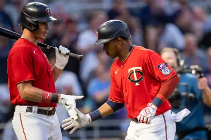 Jun 7, 2022; Minneapolis, Minnesota, USA;  Minnesota Twins right fielder Max Kepler (26) congratulates shortstop Jorge Polanco (11) after scoring against the New York Yankees in the fifth inning at Target Field. Mandatory Credit: Brad Rempel-USA TODAY Sports