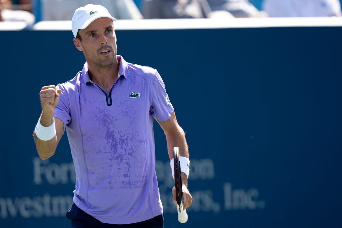 Roberto Bautista Agut reacts to winning a point against Borna Coric during the second set of their match in the Western & Southern Open at the Lindner Family Tennis Center in Mason, Ohio, on Thursday, Aug. 18, 2022.

Western Southern Open Day Four Night 828