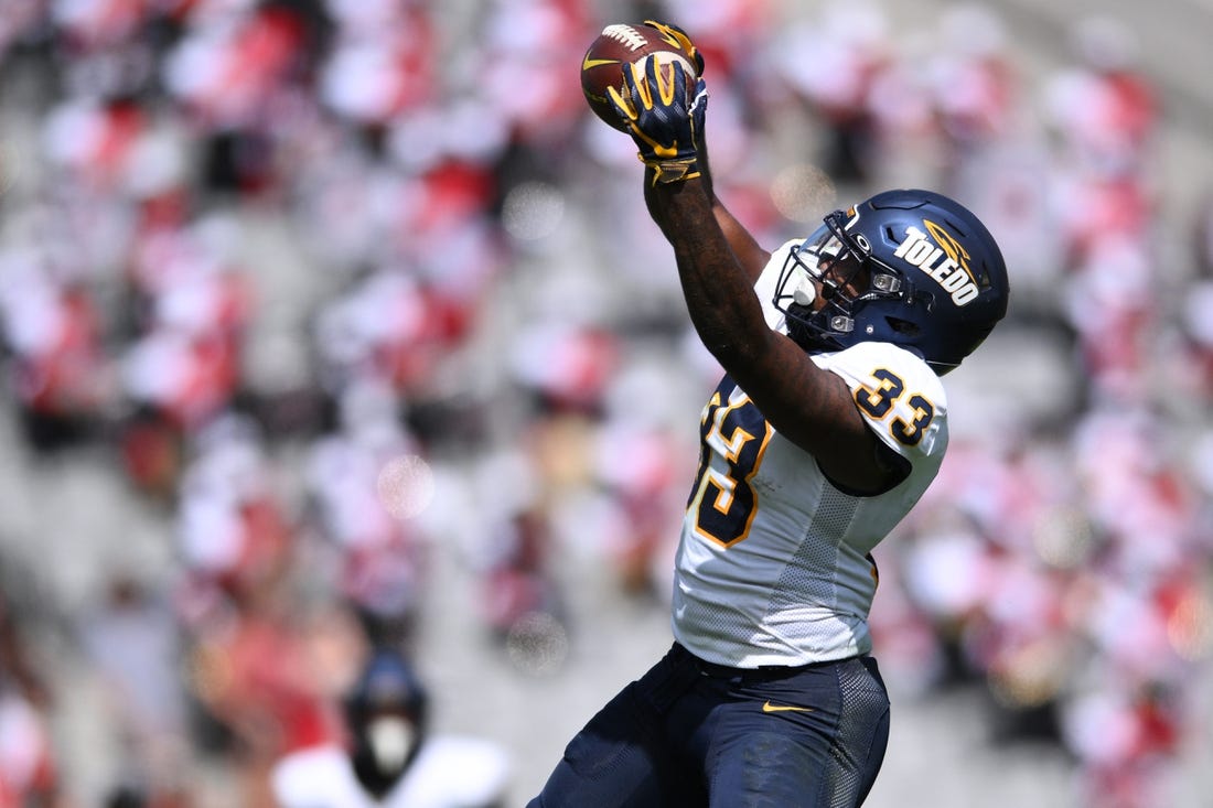 Toledo running back Peny Boone, second in the nation in yards per carry, powers the Rockets into the MAC title game. Mandatory Credit: Orlando Ramirez-USA TODAY Sports