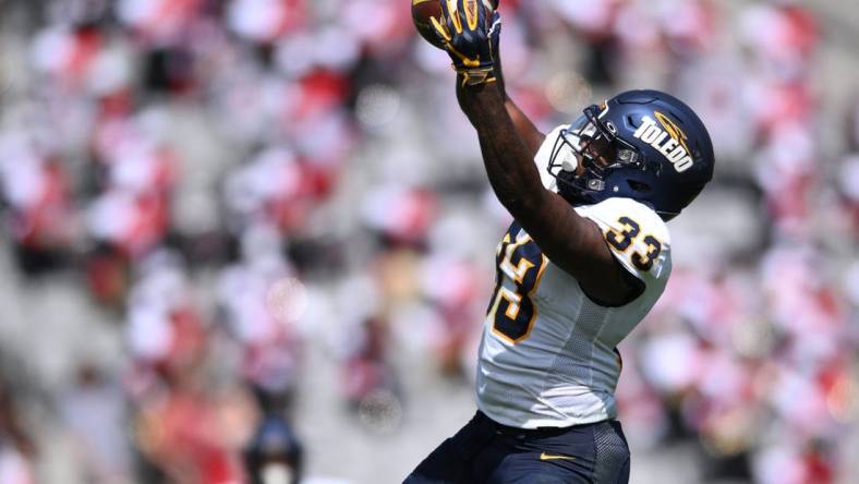 Toledo running back Peny Boone, second in the nation in yards per carry, powers the Rockets into the MAC title game. Mandatory Credit: Orlando Ramirez-USA TODAY Sports