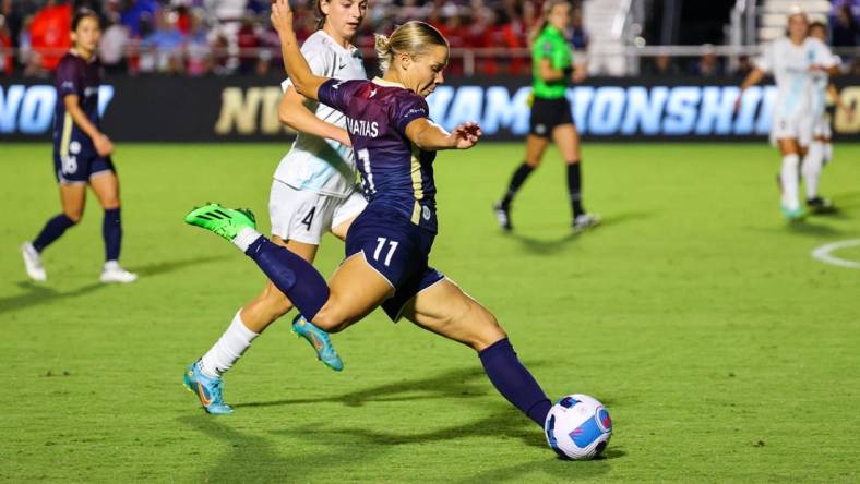 Sep 24, 2022; Cary, North Carolina, USA; North Carolina Courage defender Merritt Mathias (11) controls the ball as New Jersey/New York Gotham FC forward Paige Monaghan (4) defends during the second half at WakeMed Soccer Park. Mandatory Credit: Jaylynn Nash-USA TODAY Sports