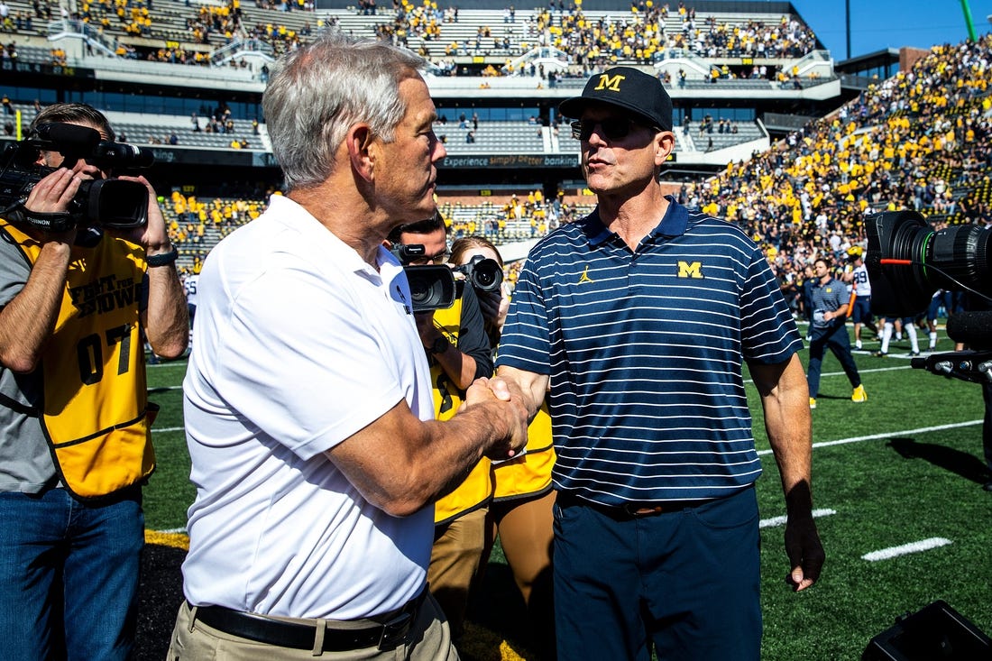 Iowa head coach Kirk Ferentz, left, shakes hands with Michigan head coach Jim Harbaugh after a NCAA Big Ten Conference college football game, Saturday, Oct. 1, 2022, at Kinnick Stadium in Iowa City, Iowa.

221001 Mich Iowa Fb 028 Jpg