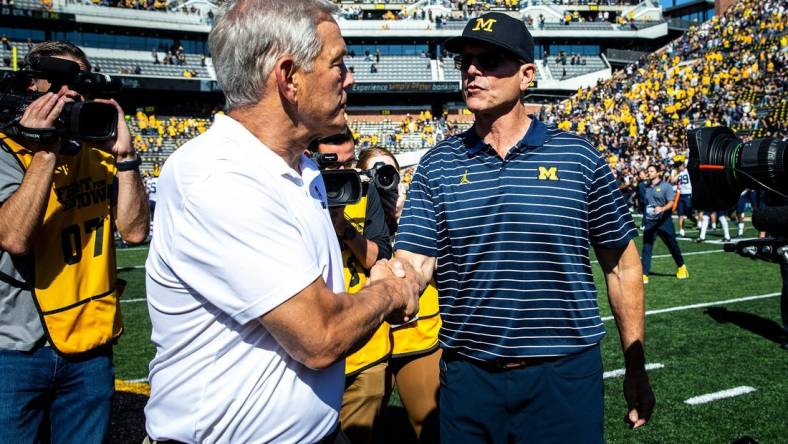 Iowa head coach Kirk Ferentz, left, shakes hands with Michigan head coach Jim Harbaugh after a NCAA Big Ten Conference college football game, Saturday, Oct. 1, 2022, at Kinnick Stadium in Iowa City, Iowa.

221001 Mich Iowa Fb 028 Jpg