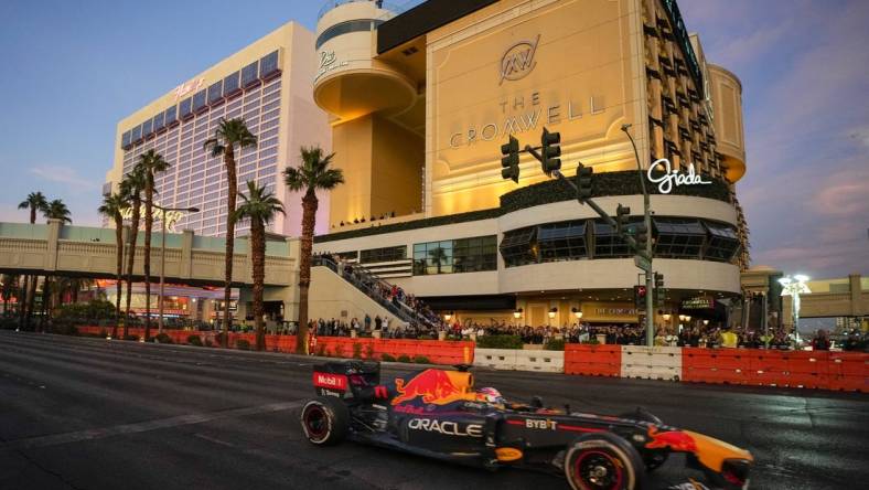 Nov 5, 2022; Las Vegas, Nevada, USA;  Oracle Red Bull Racing driver Sergio Perez drives on the track during the Formula One Las Vegas Grand Prix Launch Party at Las Vegas Strip. Mandatory Credit: Ray Acevedo-USA TODAY Sports