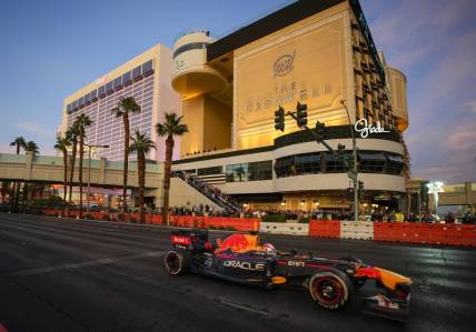 Nov 5, 2022; Las Vegas, Nevada, USA;  Oracle Red Bull Racing driver Sergio Perez drives on the track during the Formula One Las Vegas Grand Prix Launch Party at Las Vegas Strip. Mandatory Credit: Ray Acevedo-USA TODAY Sports