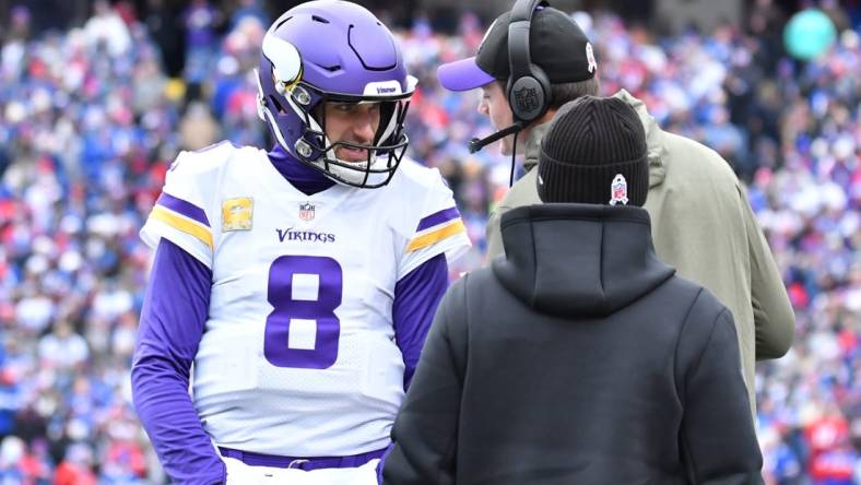Nov 13, 2022; Orchard Park, New York, USA; Minnesota Vikings quarterback Kirk Cousins (8) gets instrucyion from head coach Kevin O'Connell in the first quarter game against the Buffalo Bills at Highmark Stadium. Mandatory Credit: Mark Konezny-USA TODAY Sports