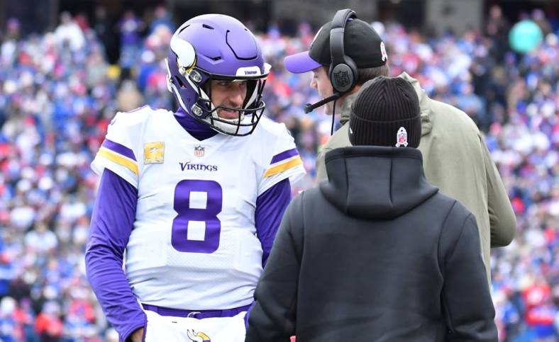 Nov 13, 2022; Orchard Park, New York, USA; Minnesota Vikings quarterback Kirk Cousins (8) gets instrucyion from head coach Kevin O'Connell in the first quarter game against the Buffalo Bills at Highmark Stadium. Mandatory Credit: Mark Konezny-USA TODAY Sports