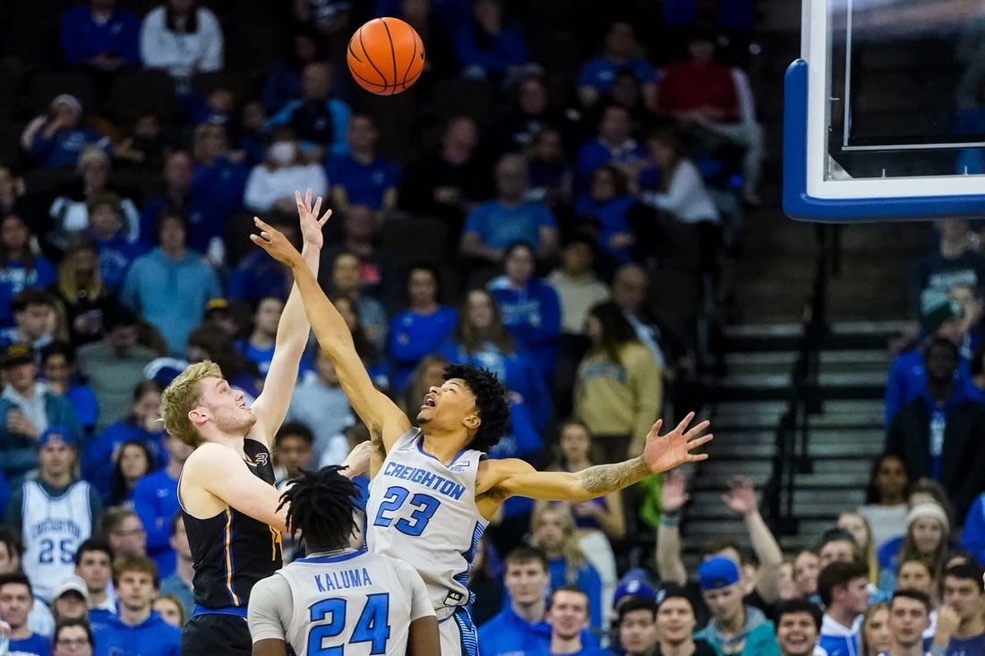 Nov 17, 2022; Omaha, Nebraska, USA; UC Riverside Highlanders forward Wil Tattersall (14) puts up a shot against Creighton Bluejays guard Trey Alexander (23) during the second half at CHI Health Center Omaha. Mandatory Credit: Dylan Widger-USA TODAY Sports