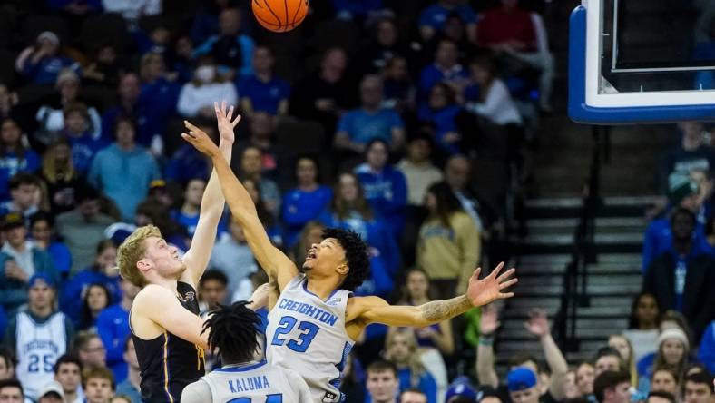 Nov 17, 2022; Omaha, Nebraska, USA; UC Riverside Highlanders forward Wil Tattersall (14) puts up a shot against Creighton Bluejays guard Trey Alexander (23) during the second half at CHI Health Center Omaha. Mandatory Credit: Dylan Widger-USA TODAY Sports