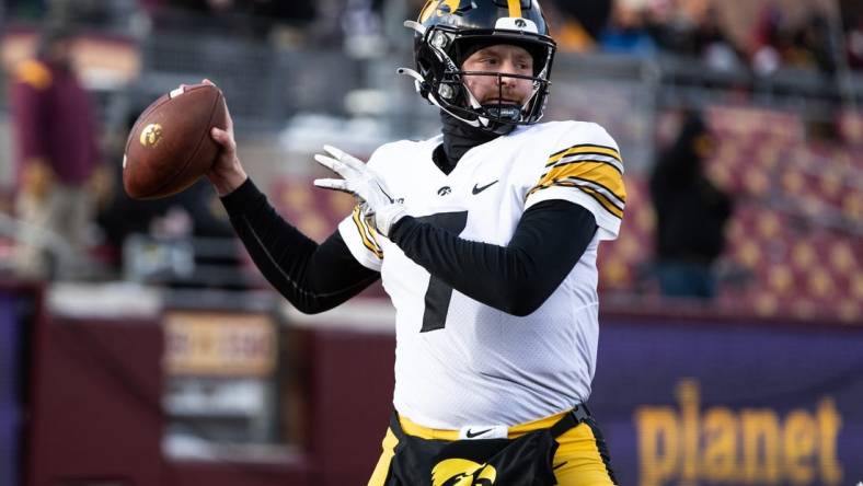 Nov 19, 2022; Minneapolis, Minnesota, USA; Iowa Hawkeyes quarterback Spencer Petras (7) warms up before the game against the Minnesota Golden Gophers at Huntington Bank Stadium. Mandatory Credit: Matt Krohn-USA TODAY Sports