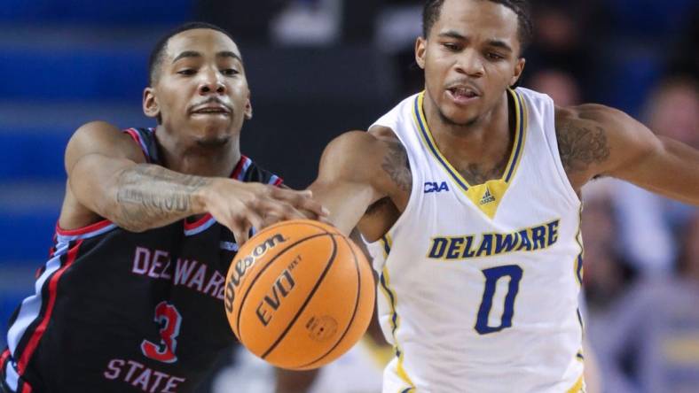 Delaware State's Martaz Robinson moves too late to stop Delaware's Jameer Nelson Jr. from getting to a loose ball  in the first half of the Blue Hens' 77-69 win at the Bob Carpenter Center, Wednesday, Dec. 7, 2022.

Ncaa Basketball Wil Hens Hornets Hoops Delaware State At Delaware