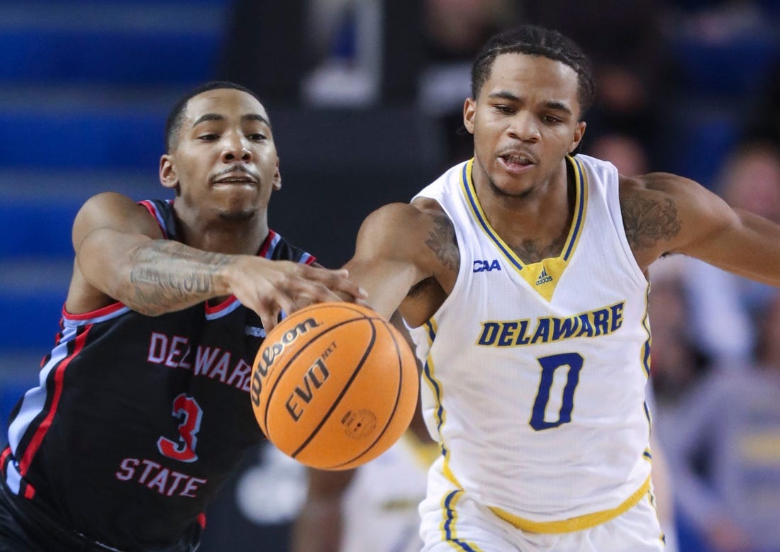 Delaware State's Martaz Robinson moves too late to stop Delaware's Jameer Nelson Jr. from getting to a loose ball  in the first half of the Blue Hens' 77-69 win at the Bob Carpenter Center, Wednesday, Dec. 7, 2022.

Ncaa Basketball Wil Hens Hornets Hoops Delaware State At Delaware