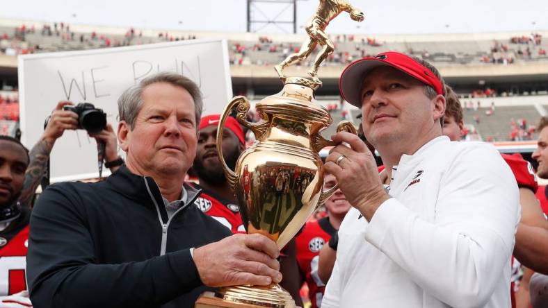 Georgia Gov. Brian Kemp presents Georgia coach Kirby Smart with the Governors Cup after a NCAA college football game between Georgia Tech and Georgia in Athens, Ga., on Saturday, Nov. 26, 2022. Georgia won 37-14.

News Joshua L Jones