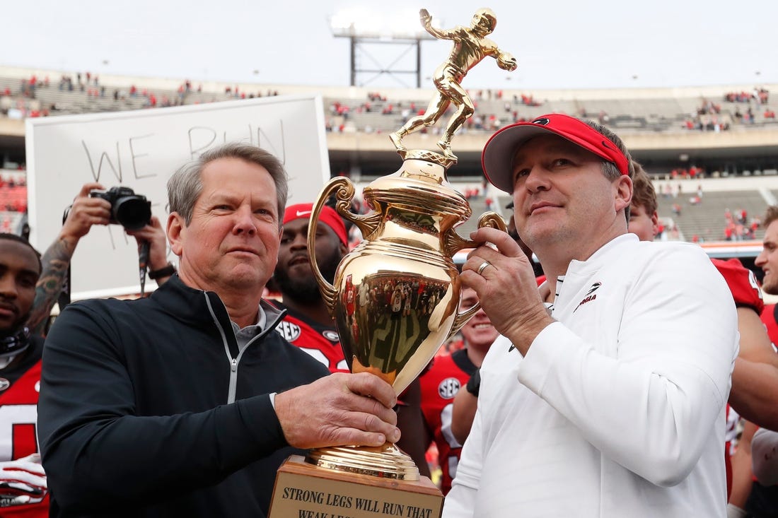 Georgia Gov. Brian Kemp presents Georgia coach Kirby Smart with the Governors Cup after a NCAA college football game between Georgia Tech and Georgia in Athens, Ga., on Saturday, Nov. 26, 2022. Georgia won 37-14.

News Joshua L Jones