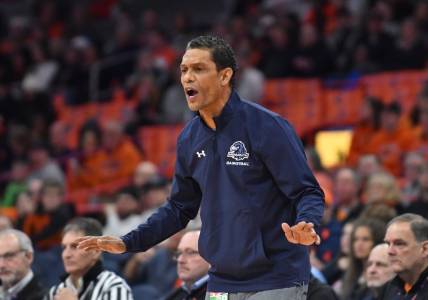 Dec 12, 2022; Syracuse, New York, USA; Monmouth Hawks head coach King Rice calls out to his team in the first half against the Syracuse Orange at JMA Wireless Dome. Mandatory Credit: Mark Konezny-USA TODAY Sports