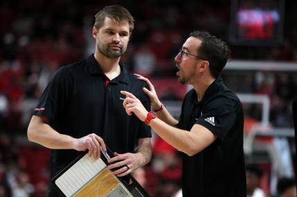 Dec 13, 2022; Lubbock, Texas, USA;  Eastern Washington Eagles coach David Riley and assistant coach Pedro Garcia Rosado in the second half during the game against the Texas Tech Red Raiders at United Supermarkets Arena. Mandatory Credit: Michael C. Johnson-USA TODAY Sports
