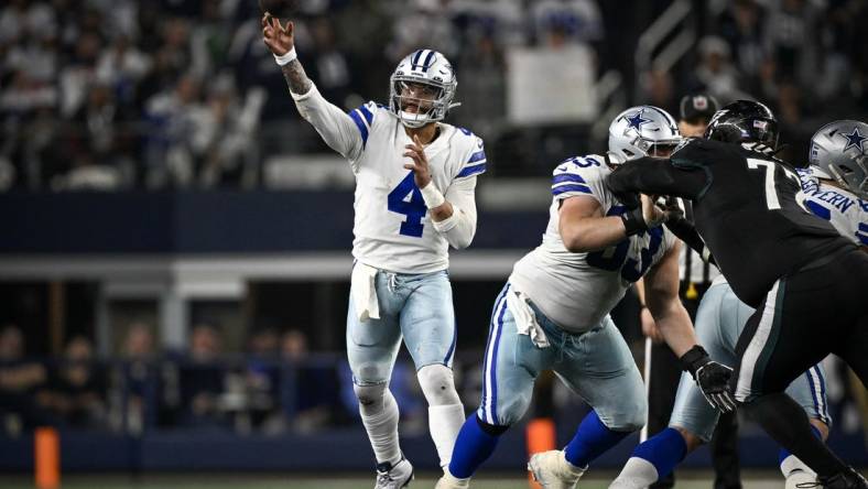 Dec 24, 2022; Arlington, Texas, USA; Dallas Cowboys quarterback Dak Prescott (4) in action during the game between the Dallas Cowboys and the Philadelphia Eagles at AT&T Stadium. Mandatory Credit: Jerome Miron-USA TODAY Sports