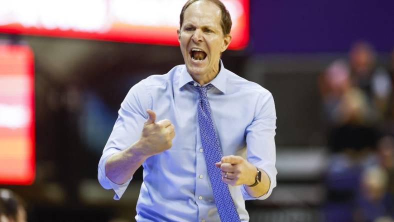 Jan 26, 2023; Seattle, Washington, USA; Washington Huskies head coach Mike Hopkins speaks to players on the bench during the second half against the Arizona State Sun Devils at Alaska Airlines Arena at Hec Edmundson Pavilion. Mandatory Credit: Joe Nicholson-USA TODAY Sports