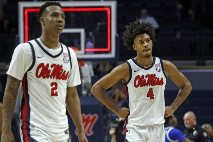 Jan 31, 2023; Oxford, Mississippi, USA; Mississippi Rebels guard TJ Caldwell (2) and forward Jaemyn Brakefield (4) walk off the court after losing to the Kentucky Wildcats at The Sandy and John Black Pavilion at Ole Miss. Mandatory Credit: Petre Thomas-USA TODAY Sports