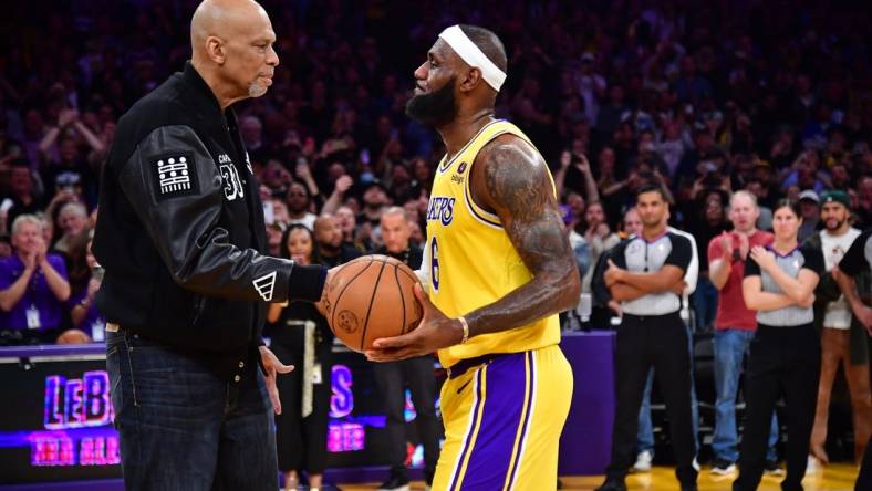 Feb 7, 2023; Los Angeles, California, USA; Los Angeles Lakers forward LeBron James (6) shakes hands with former player Kareem Abdul-Jabbar after breaking the NBA all time scoring record against the Oklahoma City Thunder during the second half at Crypto.com Arena. Mandatory Credit: Gary A. Vasquez-USA TODAY Sports