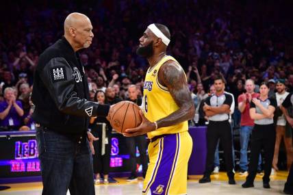 Feb 7, 2023; Los Angeles, California, USA; Los Angeles Lakers forward LeBron James (6) shakes hands with former player Kareem Abdul-Jabbar after breaking the NBA all time scoring record against the Oklahoma City Thunder during the second half at Crypto.com Arena. Mandatory Credit: Gary A. Vasquez-USA TODAY Sports
