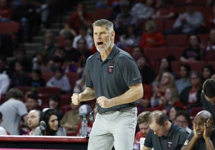 Feb 21, 2023; Norman, Oklahoma, USA; Oklahoma Sooners head coach Porter Moser reacts after a play against the Texas Tech Red Raiders during the first half at Lloyd Noble Center. Mandatory Credit: Alonzo Adams-USA TODAY Sports