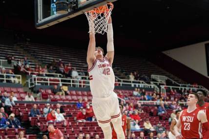 Feb 23, 2023; Stanford, California, USA;  Stanford Cardinal forward Maxime Raynaud (42) dunks the ball against Washington State Cougars forward Andrej Jakimovski (23) during the first half at Maples Pavilion. Mandatory Credit: Neville E. Guard-USA TODAY Sports