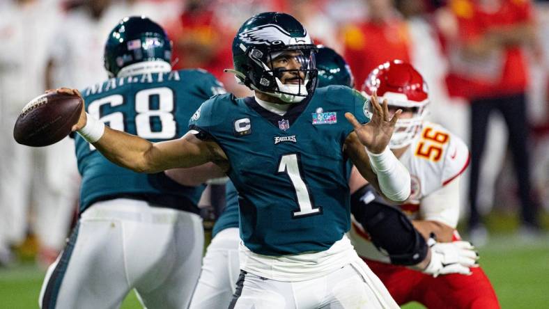 Feb 12, 2023; Glendale, Arizona, US; Philadelphia Eagles quarterback Jalen Hurts (1) throws the ball against the Kansas City Chiefs in Super Bowl LVII at State Farm Stadium. Mandatory Credit: Bill Streicher-USA TODAY Sports